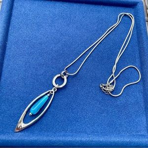 Long silver necklace with blue sphere